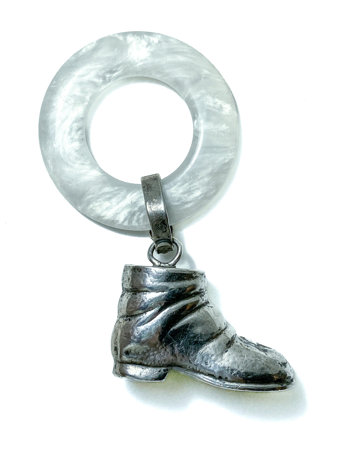 Antique Victorian Sterling Silver Baby Shoe Mother of Pearl Rattle on white background