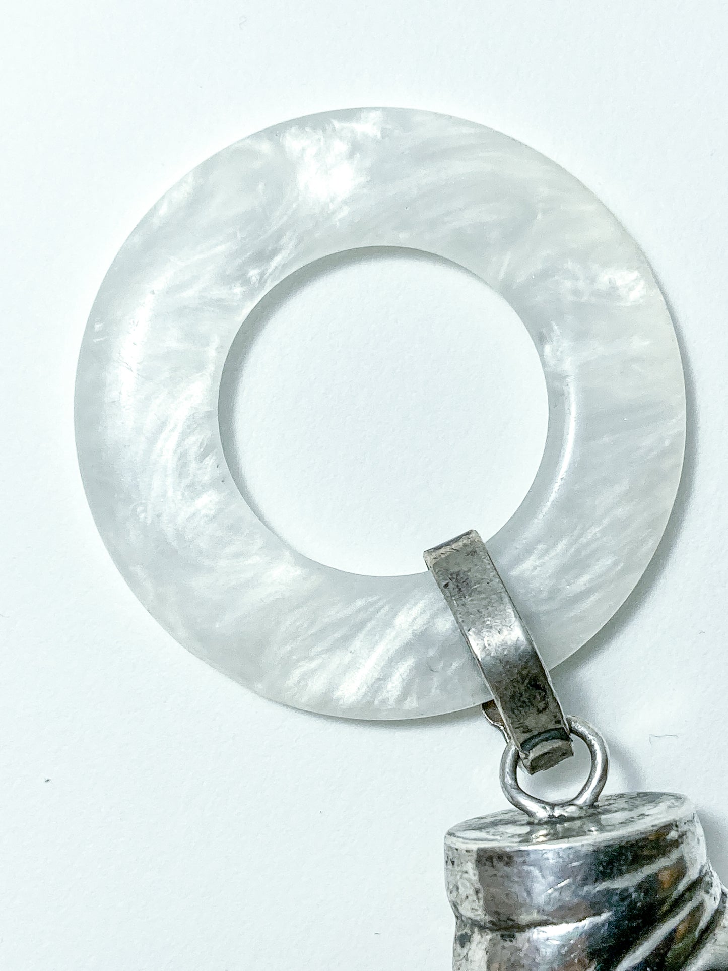 Antique Victorian Sterling Silver Baby Shoe Mother of Pearl Rattle on white background
