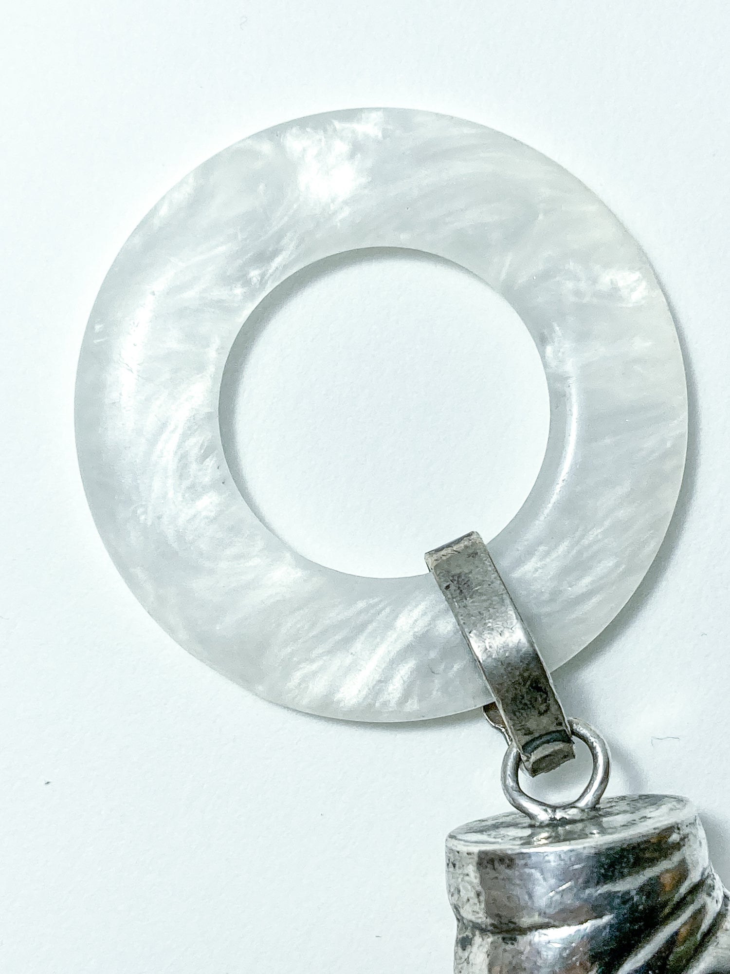 Antique Victorian Sterling Silver Baby Shoe Mother of Pearl Rattle on white background