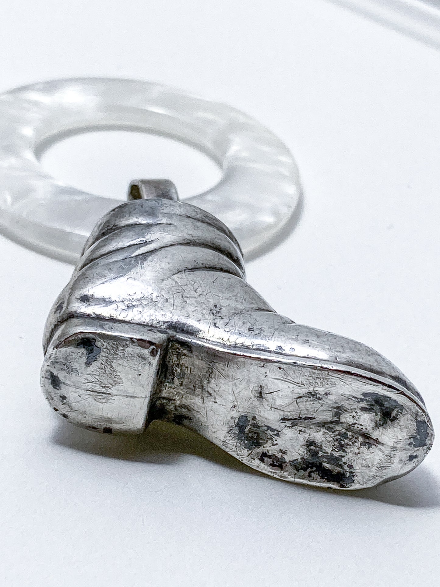 Antique Victorian Sterling Silver Baby Shoe Mother of Pearl Rattle on white background
