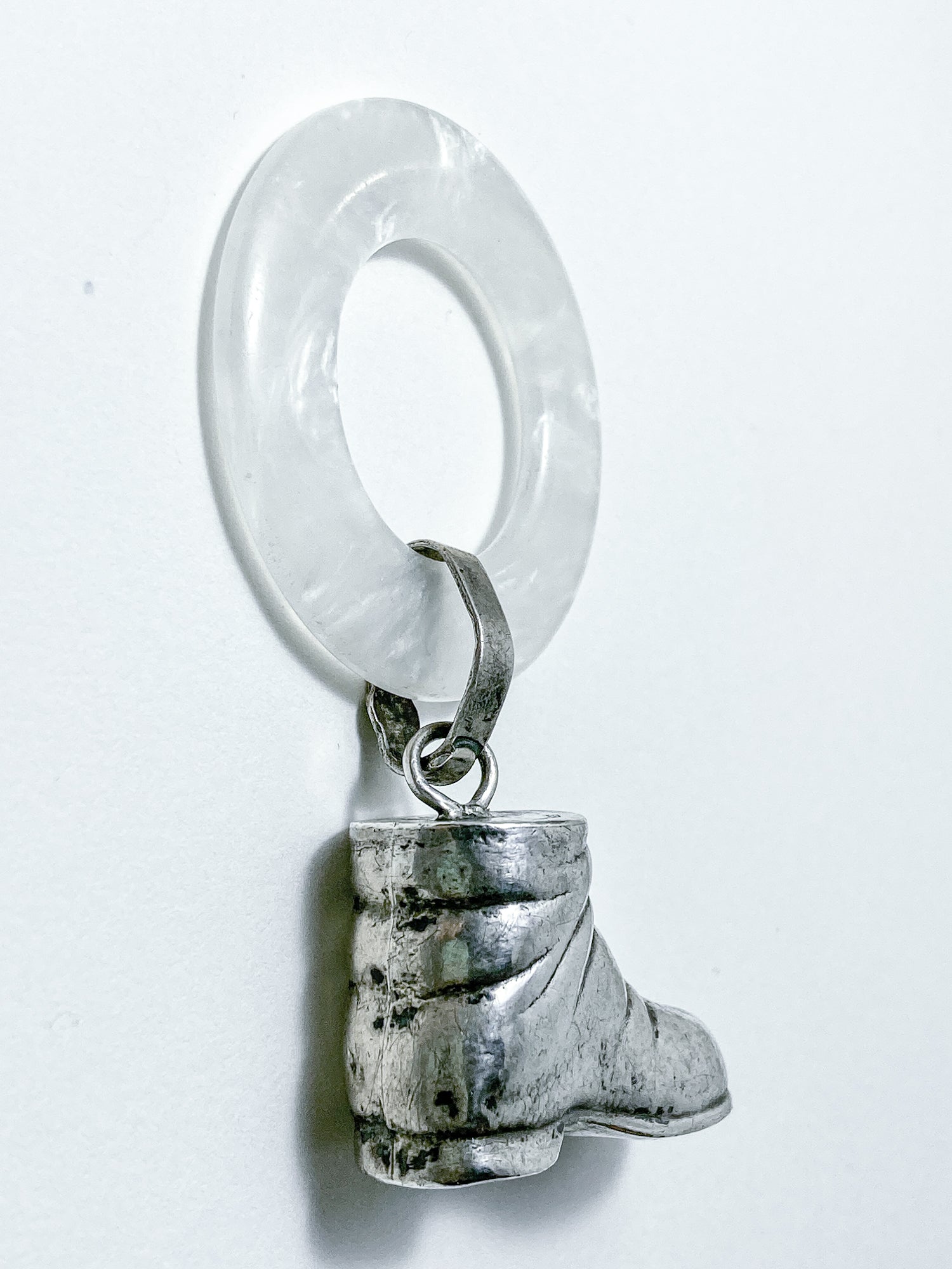 Antique Victorian Sterling Silver Baby Shoe Mother of Pearl Rattle on white background