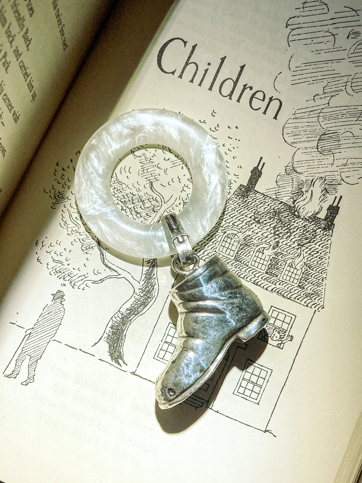 Antique Victorian Sterling Silver Baby Shoe Mother of Pearl Rattle on illustrated page that says children