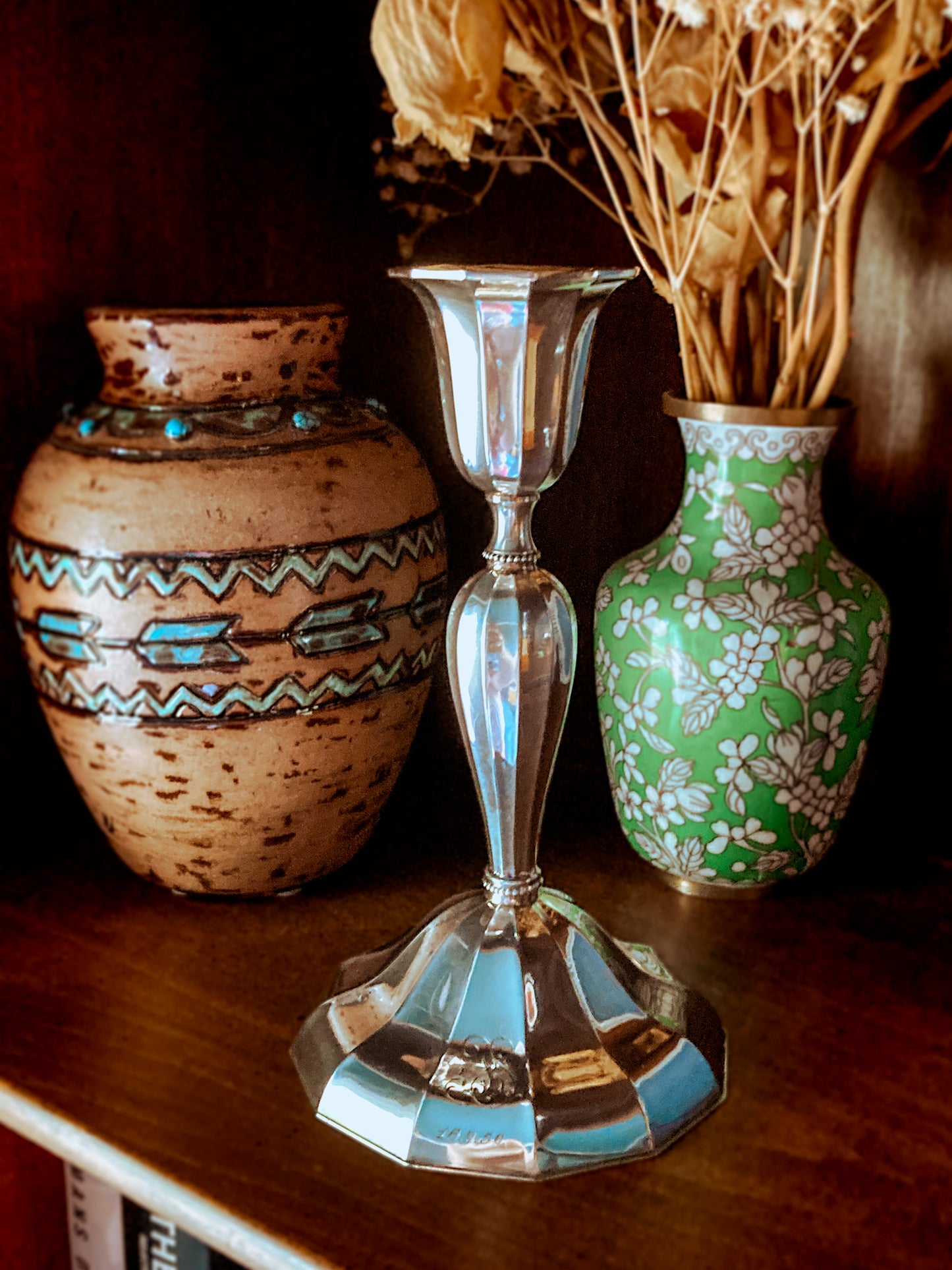 Silver candle holder with two decorative vases on a wooden surface; Elegant Vintage 1956 Finnish Sterling Silver Monogramed Candlestick