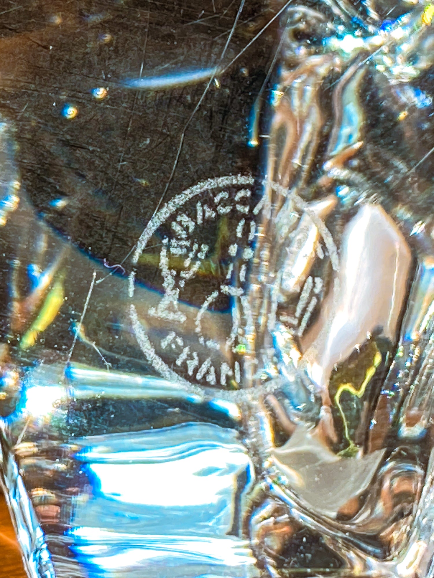 Close-up of a Baccarat Crystal Clear Oursons Wall Street Bear Paperweight Sculpture object with 'Baccarat' engraving