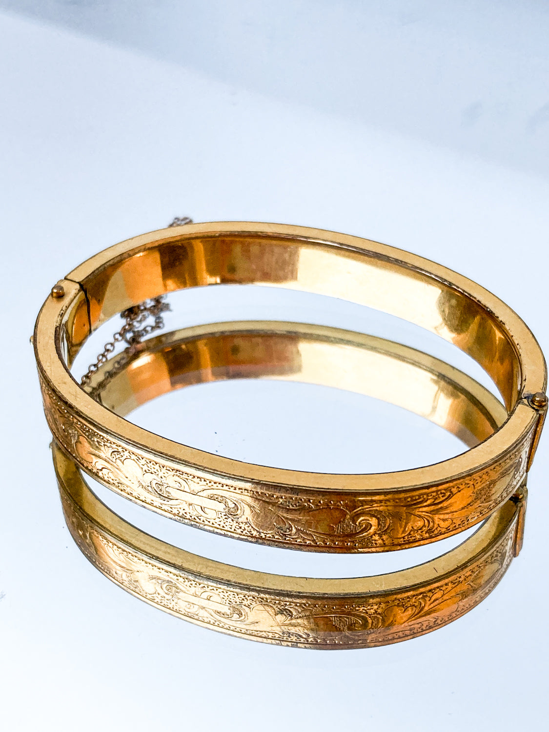 Antique Victorian Gold Filled Engraved Hinged Bangle Bracelet on mirror