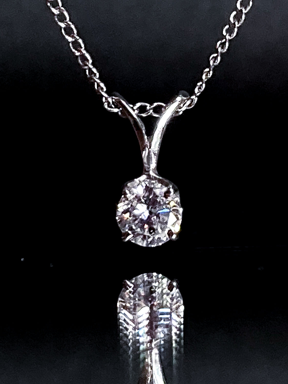 14K White Gold Solitaire Brilliant Diamond Drop Pendant Necklace Close Up Pendant on Black Background