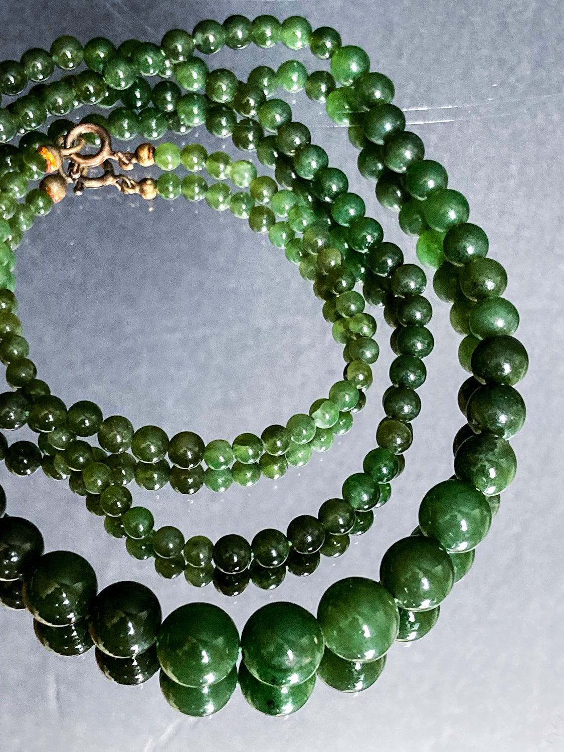 Vintage Graduated Green Nephrite Stone Bead Elongated Necklace on mirror