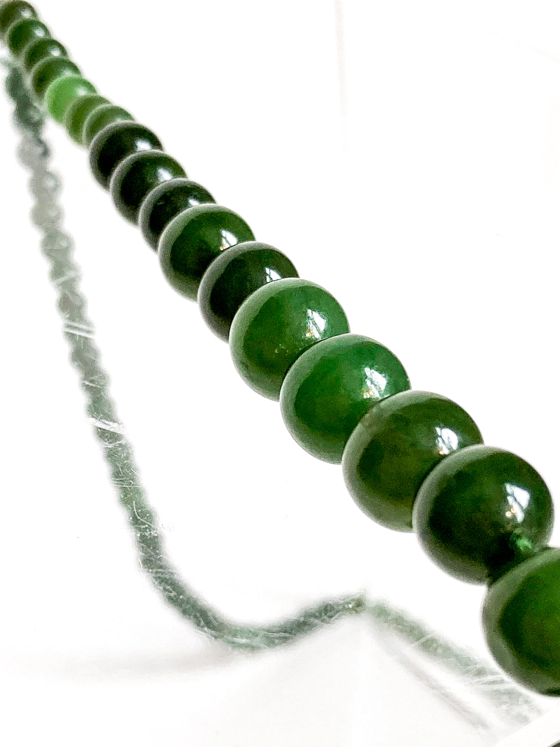 Vintage Graduated Green Nephrite Stone Bead Elongated Necklace close up beads