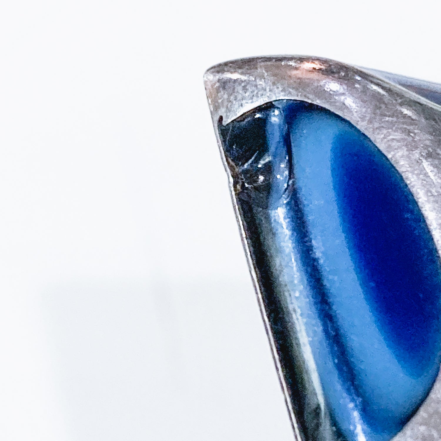 Vintage Mexico Sterling Silver Layered Blue Glass Clip On Earrings White Background Close Up small Chip in the one earring