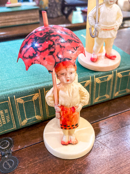 Pair Antique Celluloid Folk Figural Couple with Umbrellas Toothpick Holders