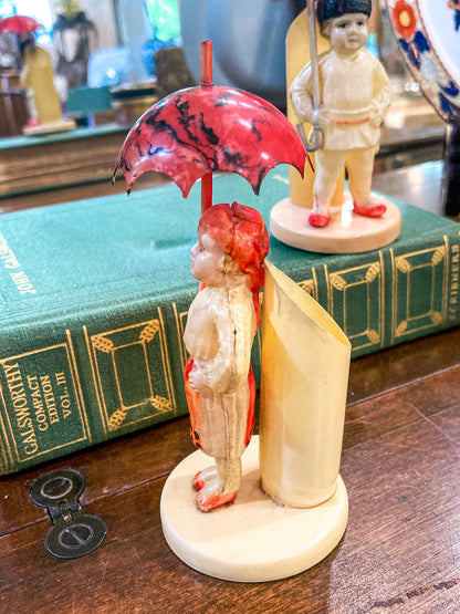 Pair Antique Celluloid Folk Figural Couple with Umbrellas Toothpick Holders