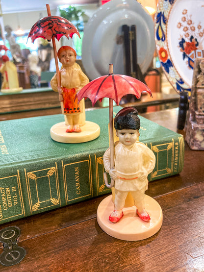 Pair Antique Celluloid Folk Figural Couple with Umbrellas Toothpick Holders