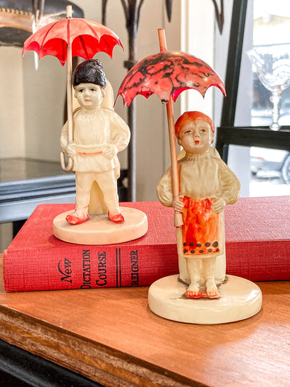 Pair Antique Celluloid Folk Figural Couple with Umbrellas Toothpick Holders