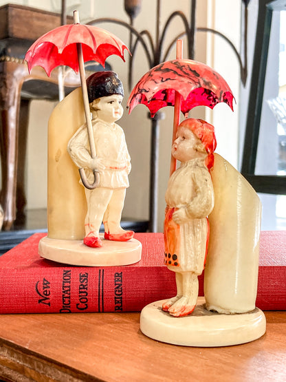 Pair Antique Celluloid Folk Figural Couple with Umbrellas Toothpick Holders