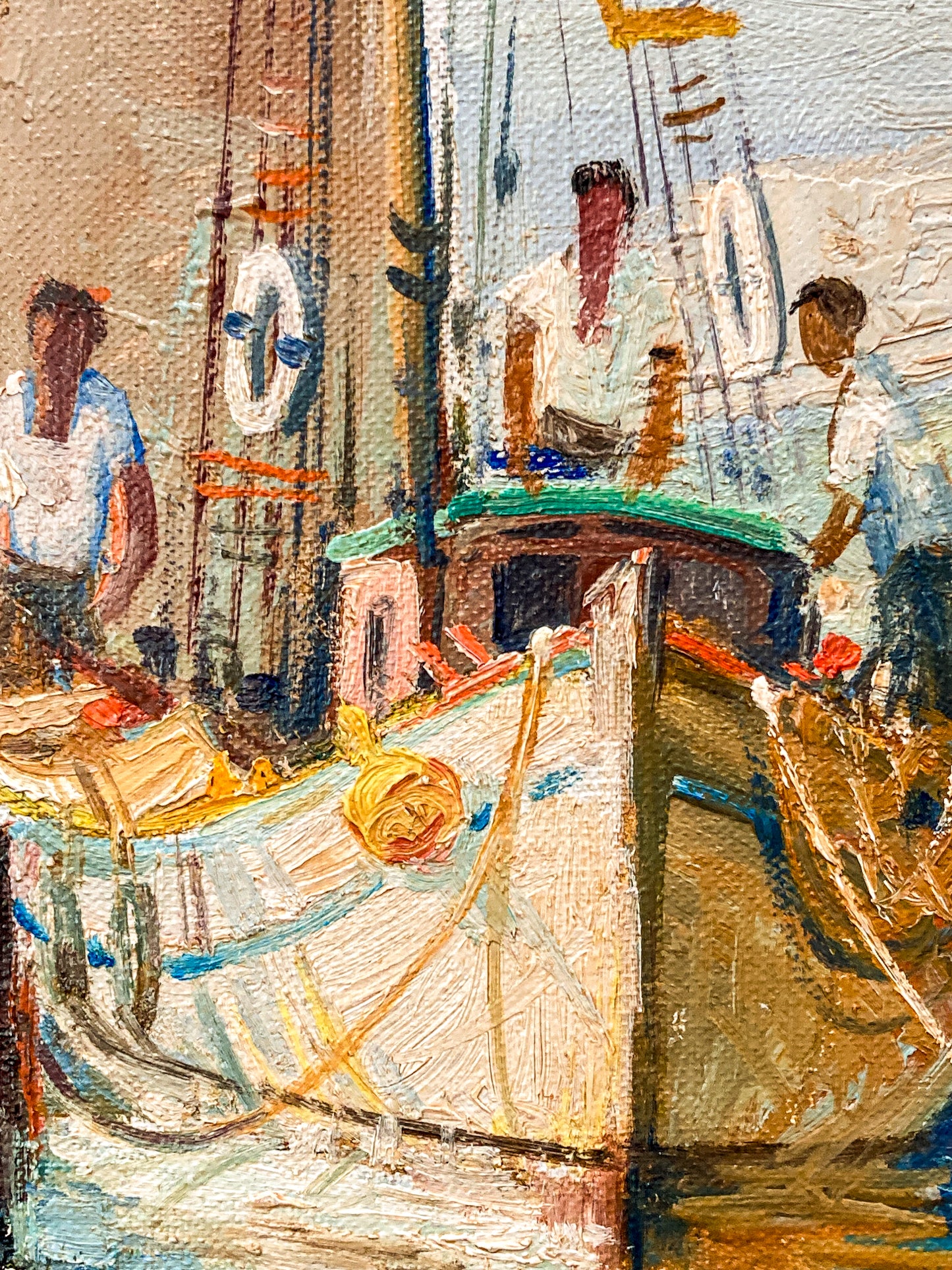 An impressionistic painting of a harbor scene with fishing boats, ropes, masts, and several people working on deck, rendered in warm beige, brown, blue, white, and yellow tones. Vintage 1960s Greece Village Seaside Boat Dock Landscape Signed Framed Oil Painting