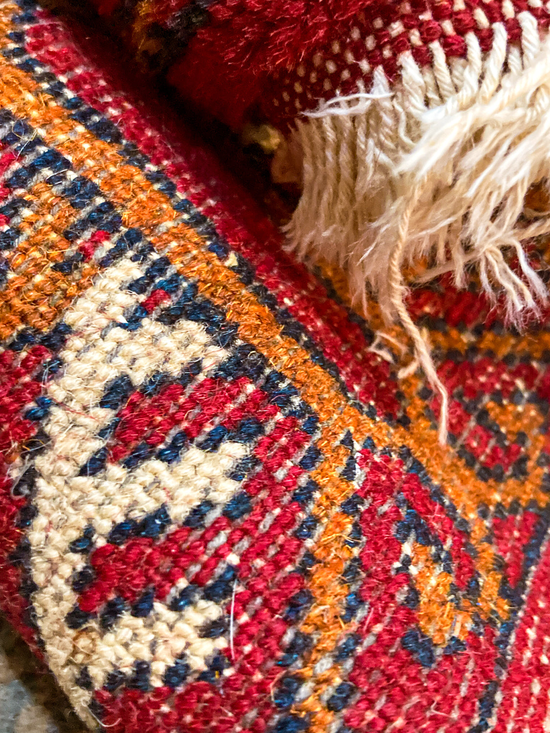 Vintage 1960s Red Orange Pakistan Hand Woven Wool 8x5 ft Area Rug Close Up Back