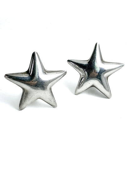 Pair of silver star-shaped earrings on a white background Vintage 925 Sterling Silver Dimensional Bubble Star Clip On Earrings