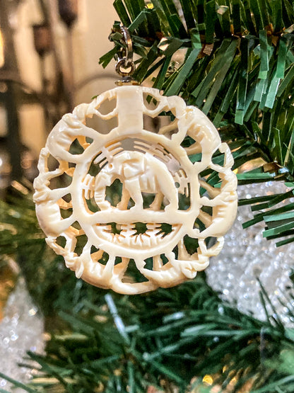 Vintage Carved Celluloid Trunk Holding Elephants Round Pendant