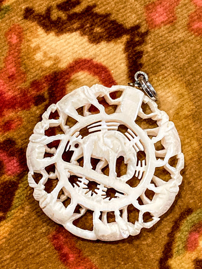 Vintage Carved Celluloid Trunk Holding Elephants Round Pendant