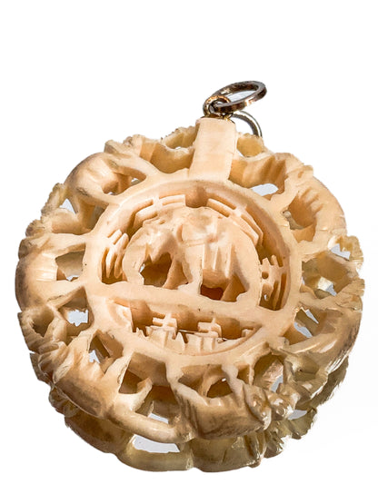 Vintage Carved Celluloid Trunk Holding Elephants Round Pendant