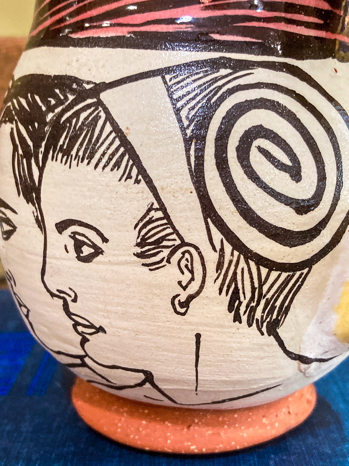 Ceramic vase with black line art of a face and spiral design Vintage Daniel Postotnik Hand Potted Illustrative Portrait Mug As Found