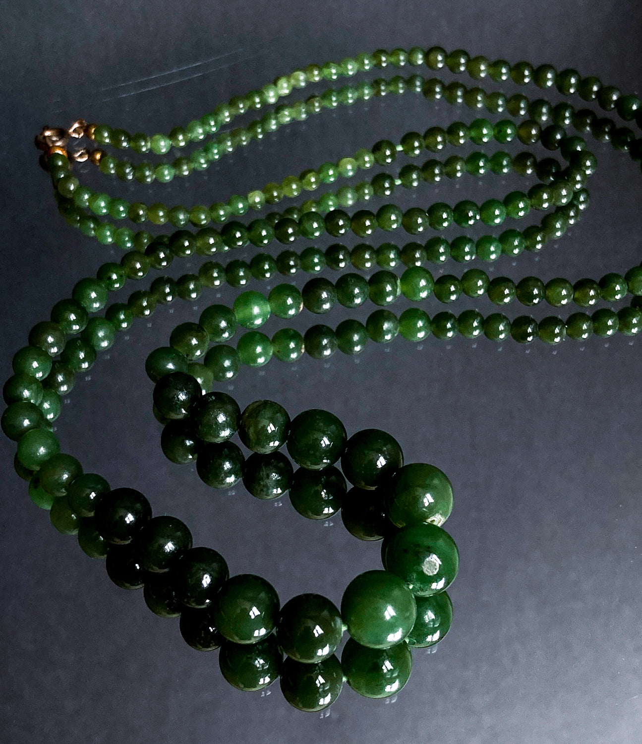 Vintage Graduated Green Nephrite Stone Bead Elongated Necklace on mirror