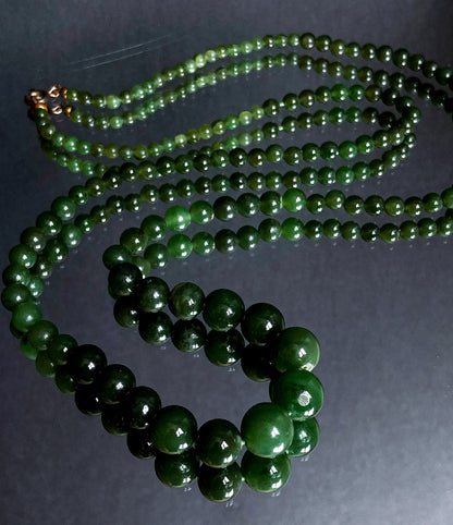 Vintage Graduated Green Nephrite Stone Bead Elongated Necklace on mirror
