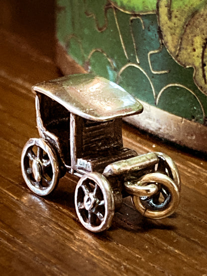 Vintage Sterling Silver Miniature Antique Automobile Car Charm Jewelry on wood
