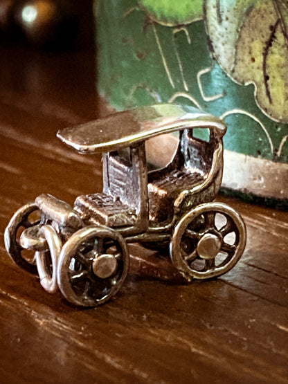 Vintage Sterling Silver Miniature Antique Automobile Car Charm Jewelry on wood