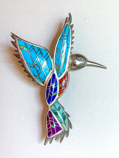 Colorful hummingbird-shaped brooch with mosaic pattern on a white  Vintage Sterling Silver Turquoise Gemstone Mosaic Inlay Hummingbird Broochbackground