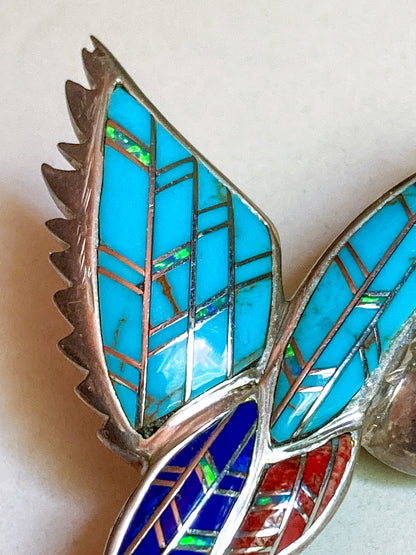 Vintage Sterling Silver Turquoise Gemstone Mosaic Inlay Hummingbird Brooch jewelry with blue, red, and green inlay on a white background