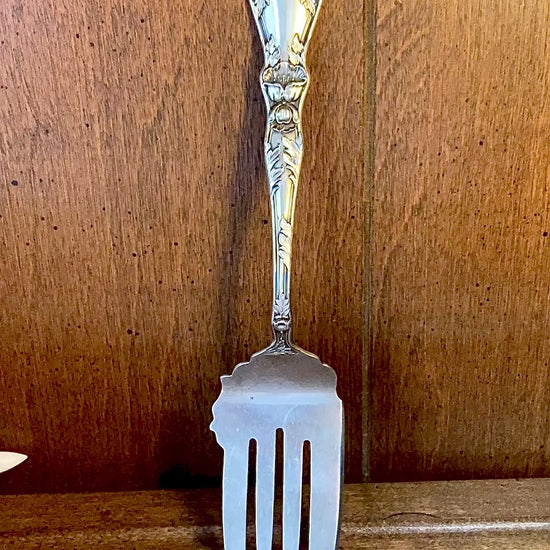 Antique Poppy Flower Pattern Baker Manchester Co Sterling Silver Cold Meat Serving Fork against wood background video
