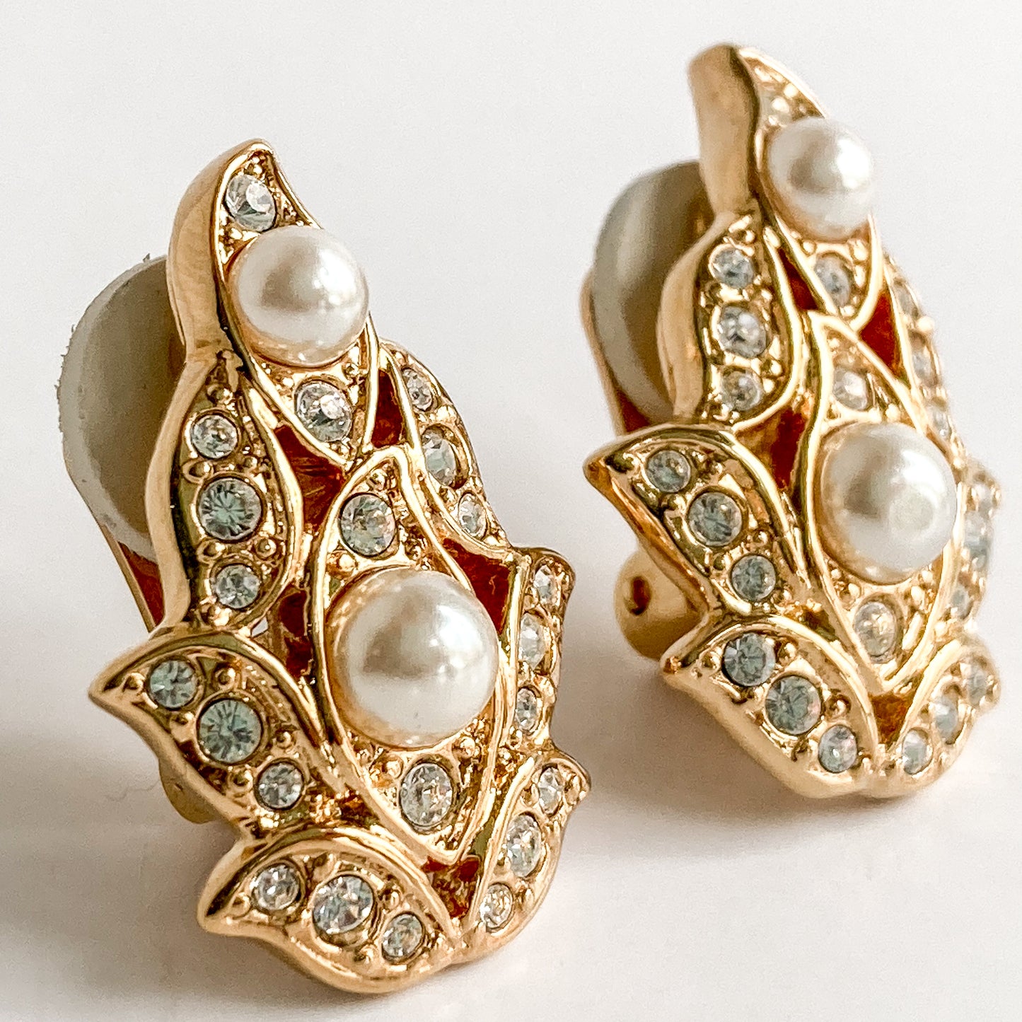 Vintage Swarovski Crystal Rhinestone Pearl Gold Leaf Clip Earrings Close Up Angled