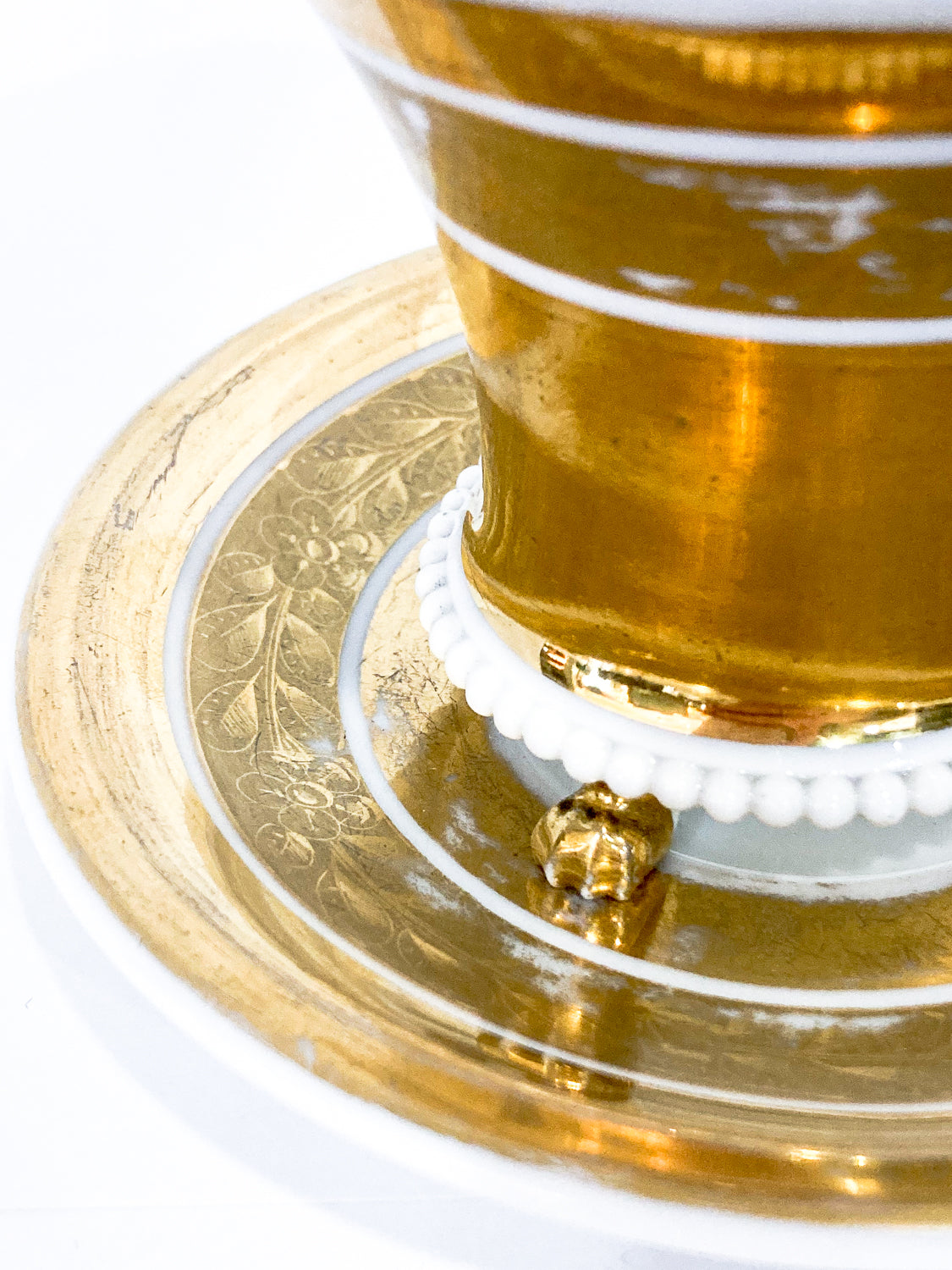 Antique Regal Golden Claw Foot Gilded Porcelain Cup & Saucer Set Close Up Saucer Detailing